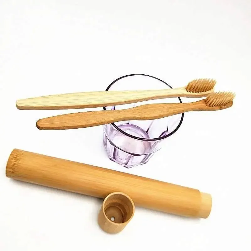 Bamboo toothbrush with infused soft bamboo charcoal bristles and bamboo containers. BPA Free