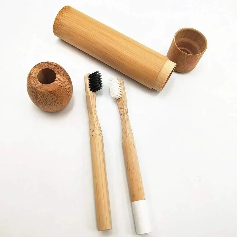 Bamboo toothbrush with infused soft bamboo charcoal bristles and bamboo containers. BPA Free