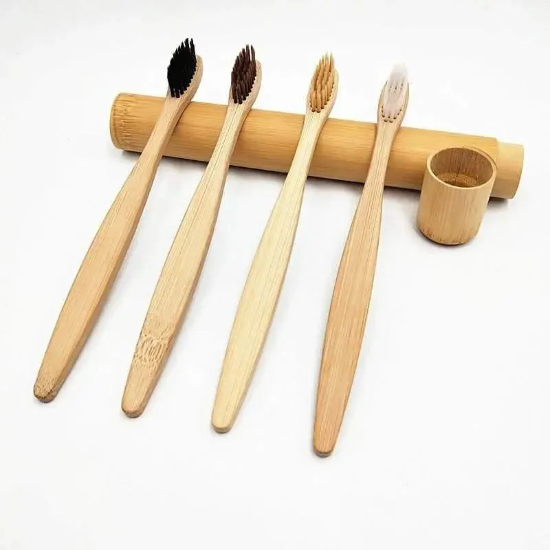 Bamboo toothbrush with infused soft bamboo charcoal bristles and bamboo containers. BPA Free